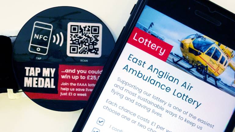 East Anglian Air Ambulance ‘Taps’ Thyngs for Mobile Lottery Subscriptions