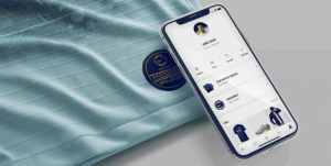 An iPhone using it's new background NFC capabilities to read a tag on a Chealsea kit. NFC stands for Near Field Communication. In this case it provides the user with access to a fan portal for the Chealsea Football Club