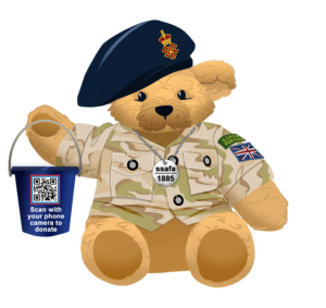An image of a teddy bear, wearing a SSAFA uniform and holding a blue donation bucket with a QR code on it.